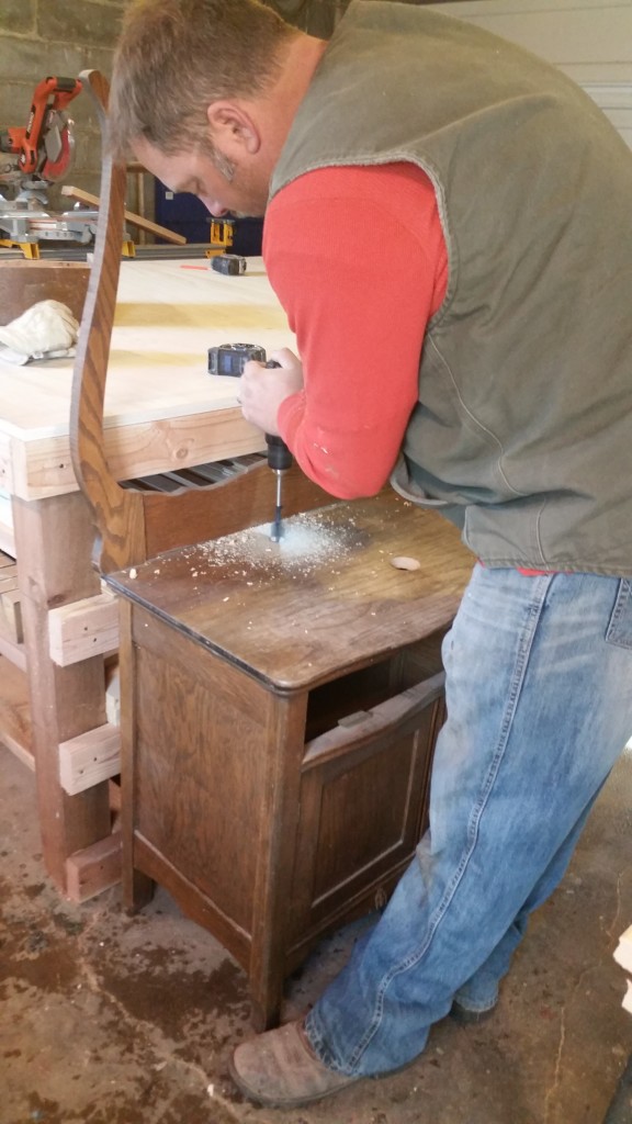Drilling the holes in the commode
